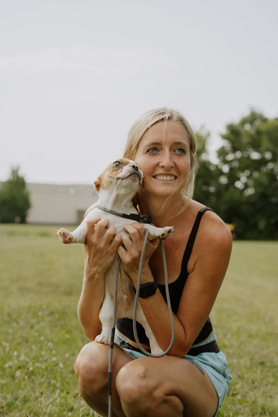A puppy in training with a K9aholics trainer